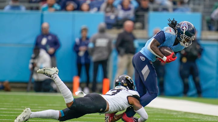 Tennessee Titans wide receiver Calvin Ridley (0) is stopped by Jacksonville Jaguars cornerback Tyson Campbell (3) during the first quarter at Nissan Stadium in Nashville, Tenn., Sunday, Dec. 8, 2024.