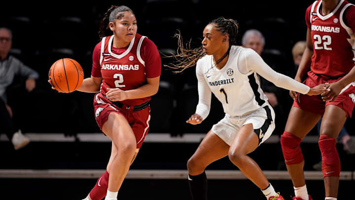 Arkansas guard Kiki Smith (2) looks for a path past Vanderbilt guard Mikayla Blakes (1) during the first quarter at Memorial Gym in Nashville, Tenn., Thursday, Jan. 23, 2025.