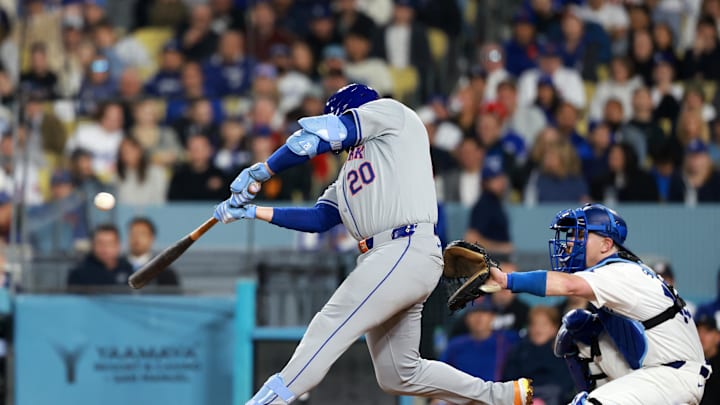 Apr 19, 2024; Los Angeles, California, USA; New York Mets first base Pete Alonso (20) hits an RBI Apr 19, 2024; Los Angeles, California, USA; New York Mets first base Pete Alonso (20) hits an RBI