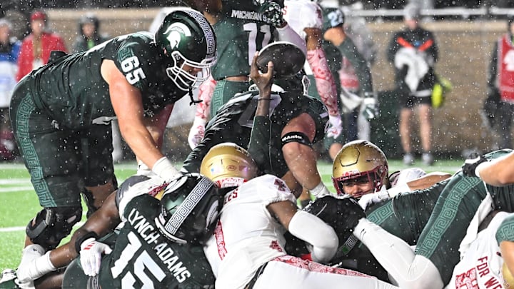 Sep 21, 2024; Chestnut Hill, Massachusetts, USA; Michigan State Spartans quarterback Aidan Chiles (2) scores a touchdown against the Boston College Eagles during the first half at Alumni Stadium. Mandatory Credit: Eric Canha-Imagn Images