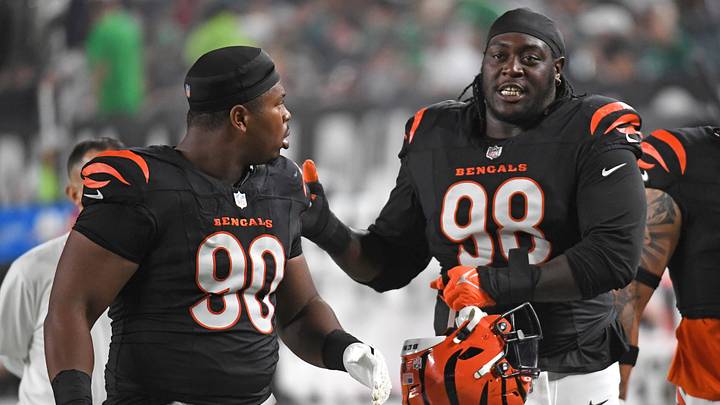 Aug 7, 2025; Philadelphia, Pennsylvania, USA; Cincinnati Bengals defensive tackle Kris Jenkins Jr. (90) and  defensive tackle T.J. Slaton Jr. (98) walk off the field at halftime against the Philadelphia Eagles at Lincoln Financial Field. Mandatory Credit: Eric Hartline-Imagn Images