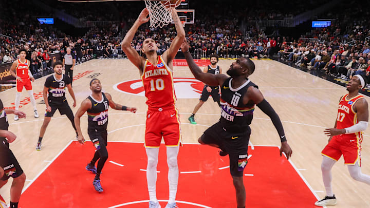 Dec 5, 2025; Atlanta, Georgia, USA; Atlanta Hawks forward Zaccharie Risacher (10) shoots against the Denver Nuggets in the second half at State Farm Arena. Mandatory Credit: Brett Davis-Imagn Images