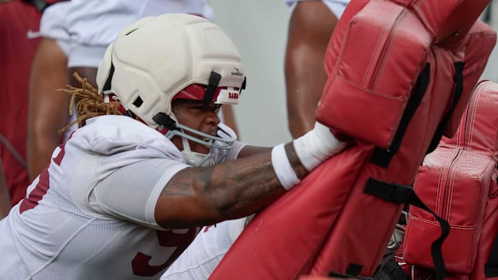 July 30, 2025; Tuscaloosa, AL, USA; Defensive lineman Tim Keenan III hit the sled during the first practice session of the preseason for the Alabama Crimson Tide. July 30, 2025; Tuscaloosa, AL, USA; Defensive lineman Tim Keenan III hit the sled during the first practice session of the preseason for the Alabama Crimson Tide.