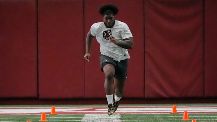 Offensive lineman Tyler Booker runs the 40-yard dash at the University of Alabama Pro Day. Offensive lineman Tyler Booker runs the 40-yard dash at the University of Alabama Pro Day.