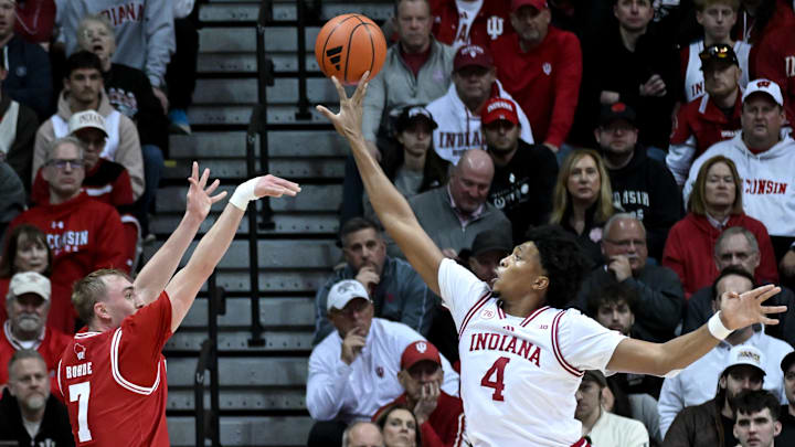 Feb 7, 2026; Bloomington, Indiana, USA; Indiana Hoosiers forward Sam Alexis (4) blocks a shot attempt from Wisconsin Badgers guard Andrew Rohde (7) during the first half at Simon Skjodt Assembly Hall. 