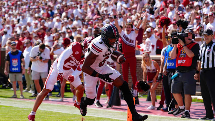 South Carolina Gamecocks tight end Joshua Simon (6) scores a touchdown in front of Oklahoma Sooners defensive back Billy Bowman Jr. (2) during a college football game between the University of Oklahoma Sooners (OU) and the South Carolina Gamecocks at Gaylord Family - Oklahoma Memorial Stadium in Norman, Okla., Saturday, Oct. 19, 2024.