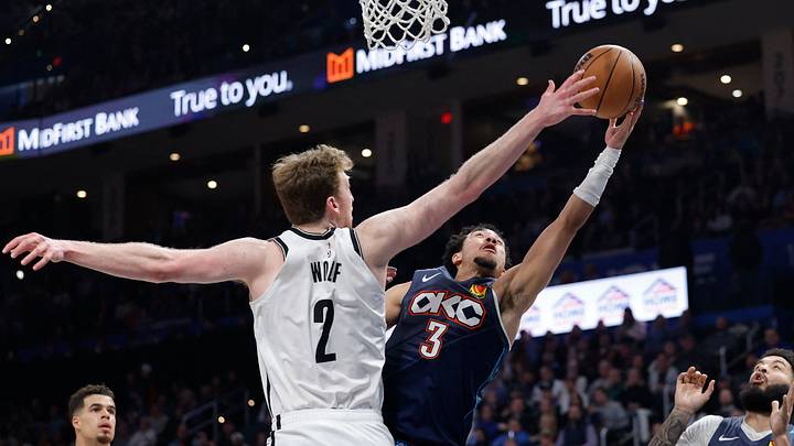 Feb 20, 2026; Oklahoma City, Oklahoma, USA; Oklahoma City Thunder guard Jared McCain (3) goes up for a basket as Brooklyn Nets forward Danny Wolf (2) defends during the second half at Paycom Center. Mandatory Credit: Alonzo Adams-Imagn Images