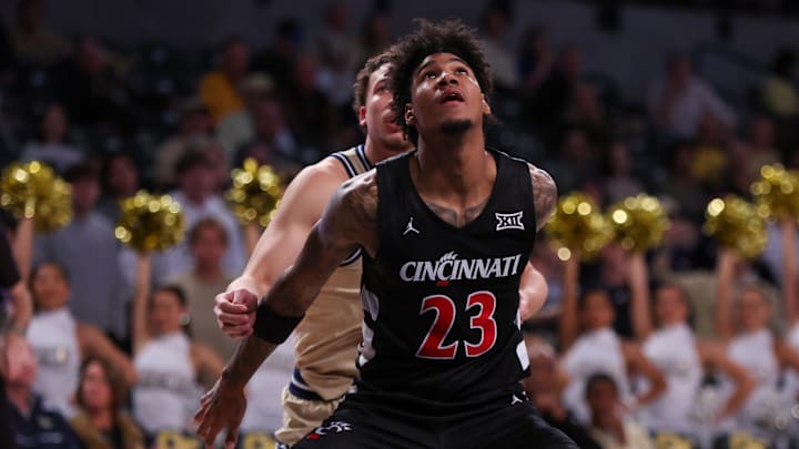 Nov 23, 2024; Atlanta, Georgia, USA; Cincinnati Bearcats forward Dillon Mitchell (23) boxes put Georgia Tech Yellow Jackets guard Lance Terry (0) in the second half at McCamish Pavilion. Mandatory Credit: Brett Davis-Imagn Images