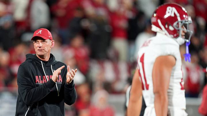 Alabama head football coach Kalen DeBoer watches players warm up before the College Football Playoff game between the University of Oklahoma Sooners (OU) and the Alabama Crimson Tide at the Gaylord Family – Oklahoma Memorial Stadium in Norman, Okla., Friday Dec. 19, 2025.