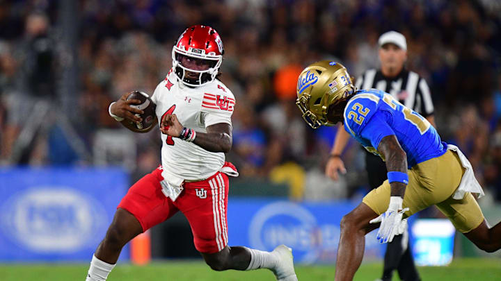 Aug 30, 2025; Pasadena, California, USA; Utah Utes quarterback Devon Dampier (4) runs the ball against UCLA Bruins defensive back Croix Stewart (22) during the first half at Rose Bowl. Aug 30, 2025; Pasadena, California, USA; Utah Utes quarterback Devon Dampier (4) runs the ball against UCLA Bruins defensive back Croix Stewart (22) during the first half at Rose Bowl.