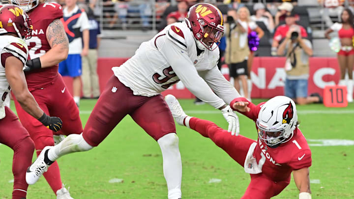 Sep 29, 2024; Glendale, Arizona, USA; Washington Commanders defensive end Dorance Armstrong (92) pushes Arizona Cardinals quarterback Kyler Murray (1) to the ground in the second half at State Farm Stadium. Mandatory Credit: Matt Kartozian-Imagn Images Sep 29, 2024; Glendale, Arizona, USA; Washington Commanders defensive end Dorance Armstrong (92) pushes Arizona Cardinals quarterback Kyler Murray (1) to the ground in the second half at State Farm Stadium. Mandatory Credit: Matt Kartozian-Imagn Images