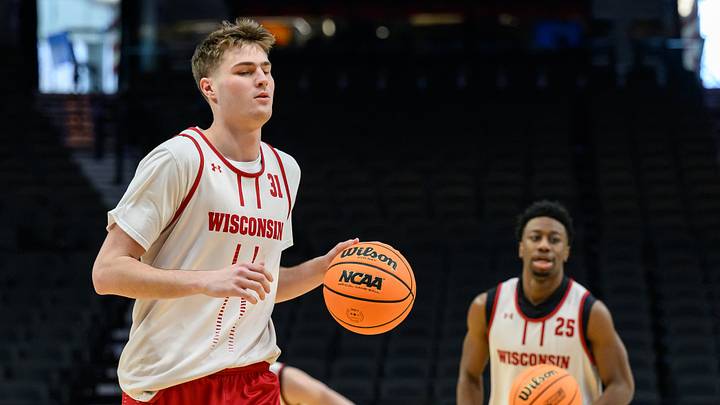 Mar 18, 2026; Portland, OR, USA; Wisconsin Badgers forward Nolan Winter (31) dribbles the ball during a practice session ahead of the first round of the men's 2026 NCAA Tournament at Moda Center. Mandatory Credit: Craig Strobeck-Imagn Images