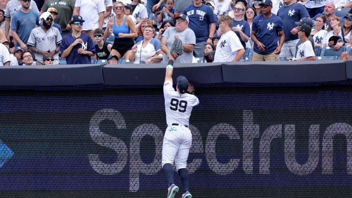 Jul 20, 2024; Bronx, New York, USA; New York Yankees right fielder Aaron Judge (99) leaps but can't catch a three run home run by Tampa Bay Rays catcher Alex Jackson (not pictured) during the fourth inning at Yankee Stadium. Jul 20, 2024; Bronx, New York, USA; New York Yankees right fielder Aaron Judge (99) leaps but can't catch a three run home run by Tampa Bay Rays catcher Alex Jackson (not pictured) during the fourth inning at Yankee Stadium.