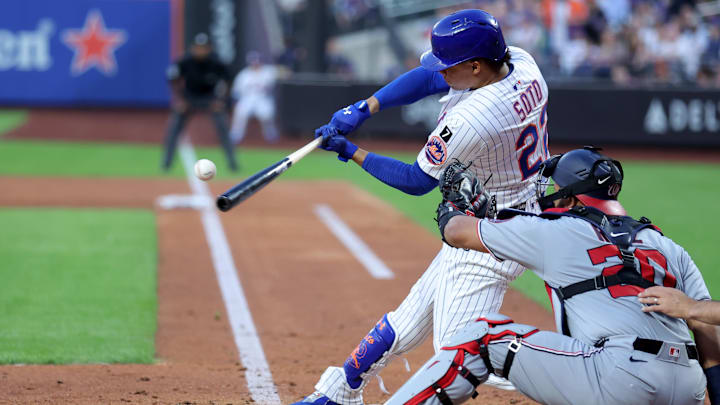 Jun 10, 2025; New York City, New York, USA; New York Mets right fielder Juan Soto (22) hits a solo home run against the Washington Nationals during the third inning at Citi Field. Mandatory Credit: Brad Penner-Imagn Images