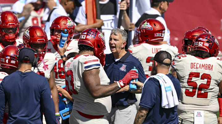 Oct 18, 2025; Houston, Texas, USA; Arizona Wildcats head coach Brent Brennan reacts in the huddle during the third quarter against the Houston Cougars at TDECU Stadium. Mandatory Credit: Maria Lysaker-Imagn Images