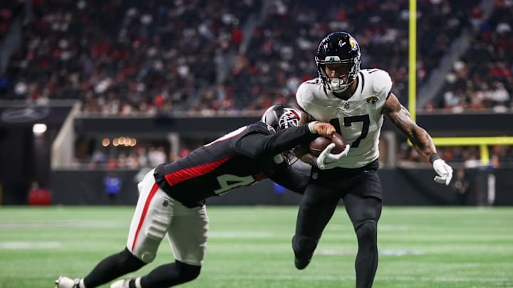 Aug 23, 2024; Atlanta, Georgia, USA; Jacksonville Jaguars tight end Evan Engram (17) is pushed out of bounds by Atlanta Falcons linebacker Bradlee Anae (47) in the second quarter at Mercedes-Benz Stadium. Mandatory Credit: Brett Davis-Imagn Images