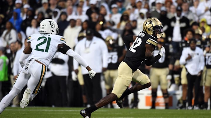 Sep 21, 2024; Boulder, Colorado, USA; Colorado Buffaloes wide receiver Travis Hunter (12) runs after a catch during the first half against the Baylor Bears at Folsom Field. Mandatory Credit: Christopher Hanewinckel-Imagn Images