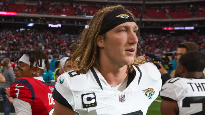 Nov 26, 2023; Houston, Texas, USA;  Jacksonville Jaguars quarterback Trevor Lawrence (16) hugs players after defeating the Houston Texans at NRG Stadium. Mandatory Credit: Thomas Shea-USA TODAY Sports