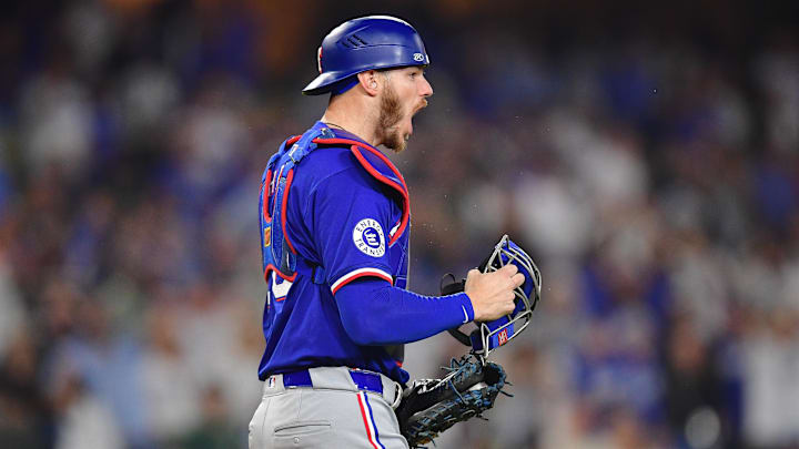 Jun 12, 2024; Los Angeles, California, USA; Texas Rangers catcher Jonah Heim (28) reacts after tagging out Los Angeles Dodgers center fielder Andy Pages (44) for the last out of the game and victory at Dodger Stadium. Mandatory Credit: Gary A. Vasquez-USA TODAY Sports