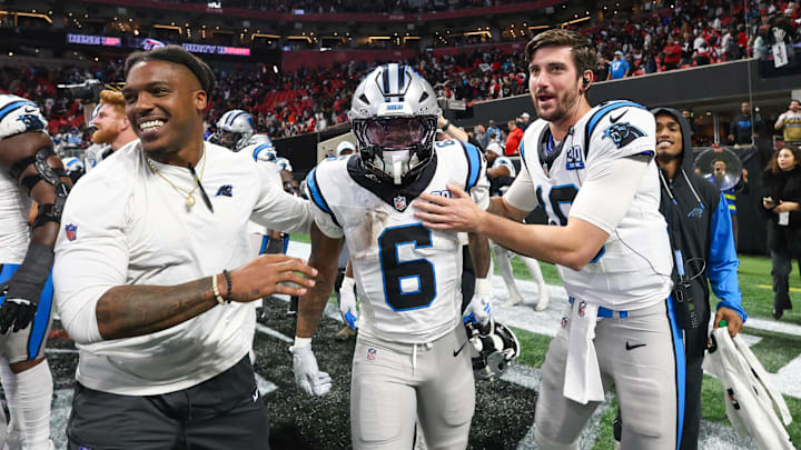 Jan 5, 2025; Atlanta, Georgia, USA; Carolina Panthers running back Miles Sanders (6) celebrates with teammates after a game-winning touchdown in overtime against the Atlanta Falcons at Mercedes-Benz Stadium. Mandatory Credit: Brett Davis-Imagn Images
