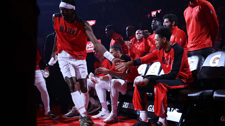 Mar 9, 2025; Portland, Oregon, USA; Portland Trail Blazers guard Anfernee Simons (1) high-fives teammate Trail Blazers’ forward Jerami Grant (9) as Grant enters the line up at Moda Center. Mandatory Credit: Jaime Valdez-Imagn Images