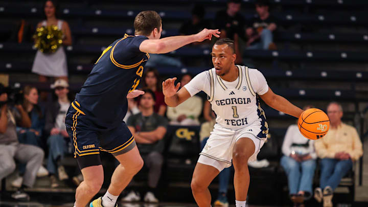 Mar 4, 2026; Atlanta, Georgia, USA; Georgia Tech Yellow Jackets guard Lamar Washington (1) dribbles the ball down the court against California Golden Bears guard Nolan Dorsey (21) during the second half at McCamish Pavilion. Mandatory Credit: Jordan Godfree-Imagn Images