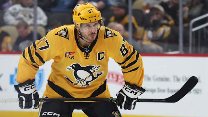 Jan 8, 2026; Pittsburgh, Pennsylvania, USA;  Pittsburgh Penguins center Sidney Crosby (87) waits to take a face-off against the New Jersey Devils during the third period at PPG Paints Arena. Mandatory Credit: Charles LeClaire-Imagn Images
