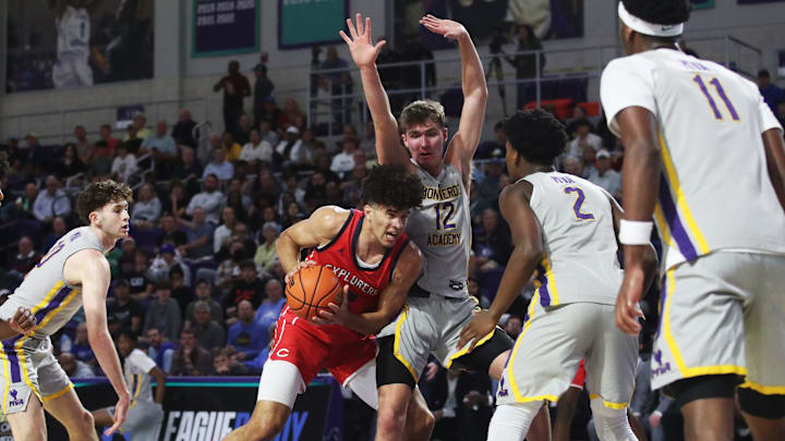 Cameron Boozer of the Miami Columbus High School basketball team drives to the basket during the championship game against Montverde at the City of Palms Classic at Suncoast Credit Union Arena in Fort Myers on Monday, Dec. 23, 2024.