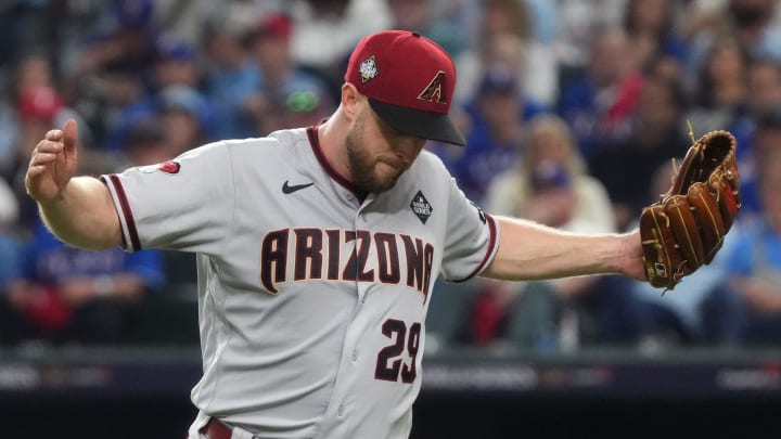 Arizona Diamondbacks starting pitcher Merrill Kelly (29) reacts after a strikeout against the Texas Rangers to end the seventh inning in game two of the 2023 World Series at Globe Life Field on Oct. 28, 2023, in Arlington, Texas. Arizona Diamondbacks starting pitcher Merrill Kelly (29) reacts after a strikeout against the Texas Rangers to end the seventh inning in game two of the 2023 World Series at Globe Life Field on Oct. 28, 2023, in Arlington, Texas.