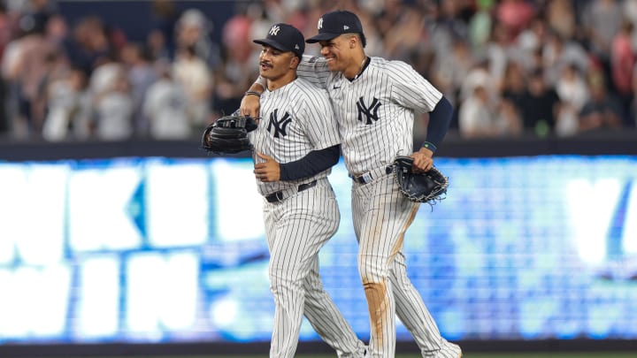 Jun 18, 2024; Bronx, New York, USA; New York Yankees right fielder Juan Soto (22) and centerfielder Trent Grisham (12) celebrates after defeating the Baltimore Orioles at Yankee Stadium. Mandatory Credit: Vincent Carchietta-USA TODAY Sports