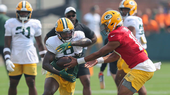 Green Bay Packers running back Josh Jacobs (8) receives a handoff from quarterback Jordan Love (10) during practice on Thursday, July 31, 2025, at Ray Nitschke Field in Ashwaubenon, Wis. 
Tork Mason/USA TODAY NETWORK-Wisconsin
