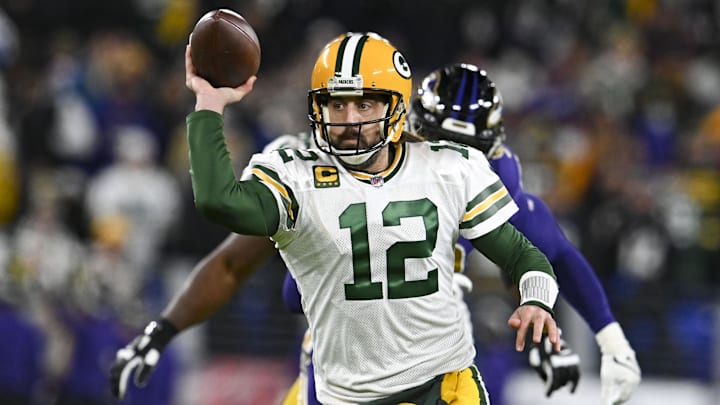 Dec 19, 2021; Baltimore, Maryland, USA;  during Green Bay Packers quarterback Aaron Rodgers (12) throws on the run during the first half against the Baltimore Ravens at M&T Bank Stadium. Mandatory Credit: Tommy Gilligan-Imagn Images