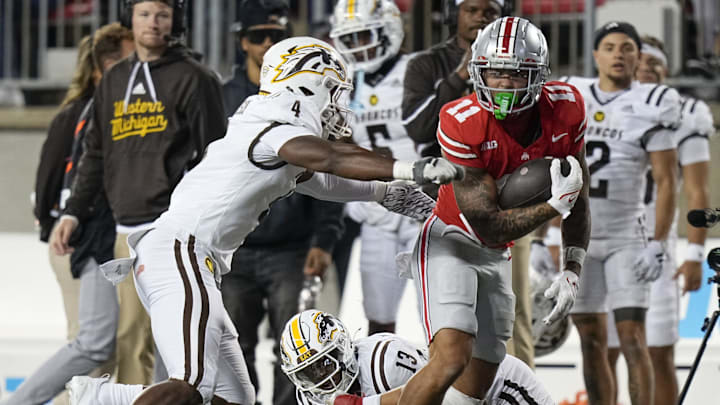 Sep 7, 2024; Columbus, Ohio, USA; Ohio State Buckeyes wide receiver Brandon Inniss (11) runs past Western Michigan Broncos linebacker Damari Roberson (4) after making a catch during the second half of the NCAA football game at Ohio Stadium.