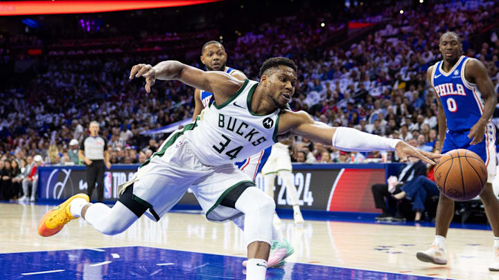 Oct 23, 2024; Philadelphia, Pennsylvania, USA; Milwaukee Bucks forward Giannis Antetokounmpo (34) reaches for a loose ball against the Philadelphia 76ers during the first quarter at Wells Fargo Center. Mandatory Credit: Bill Streicher-Imagn Images