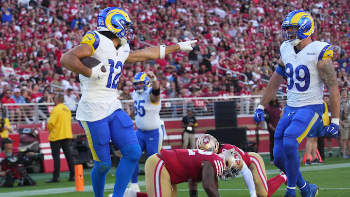 Nov 9, 2025; Santa Clara, California, USA; Los Angeles Rams wide receiver Puka Nacua (12) celebrates with Los Angeles Rams tight end Tyler Higbee (89) after scoring a touchdown past San Francisco 49ers defensive tackle Jordan Elliott (92) during the first quarter at Levi's Stadium. Mandatory Credit: Cary Edmondson-Imagn Images