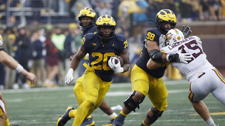 Sep 28, 2024; Ann Arbor, Michigan, USA;  Michigan Wolverines running back Kalel Mullings (20) rushes in the second half against the Minnesota Golden Gophers at Michigan Stadium. Mandatory Credit: Rick Osentoski-Imagn Images