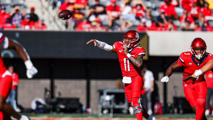 Nov 30, 2024; Tucson, Arizona, USA; Arizona Wildcats quarterback Noah Fifita (11) throws the ball during the second quarter against the Arizona State Sun Devils at Arizona Stadium. Mandatory Credit: Aryanna Frank-Imagn Images