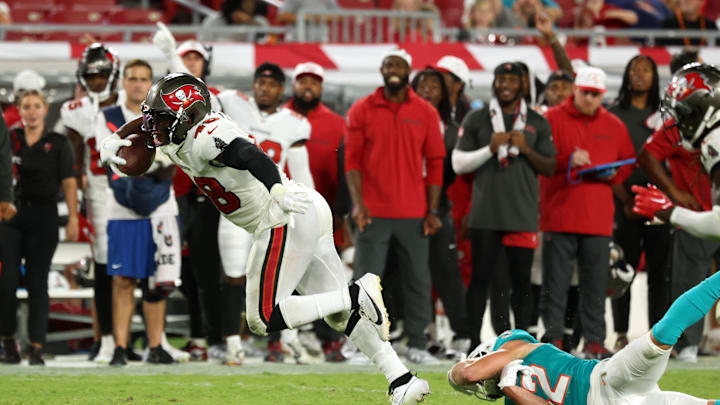 Aug 23, 2024; Tampa, Florida, USA;  Tampa Bay Buccaneers linebacker Antonio Grier Jr. (48) intercepted   the ball against the Miami Dolphins during the second half at Raymond James Stadium. Mandatory Credit: Kim Klement Neitzel-Imagn Images