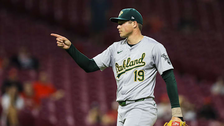 Aug 28, 2024; Cincinnati, Ohio, USA; Oakland Athletics relief pitcher Mason Miller (19) reacts after the victory over the Cincinnati Reds at Great American Ball Park.
