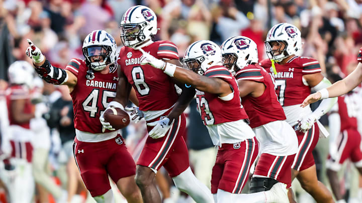Oct 25, 2025; Columbia, South Carolina, USA; South Carolina Gamecocks wide receiver Nyck Harbor (8) and teammates celebrate a Harbor fumble recovery against the Alabama Crimson Tide on a punt in the fourth quarter at Williams-Brice Stadium. Mandatory Credit: Jeff Blake-Imagn Images