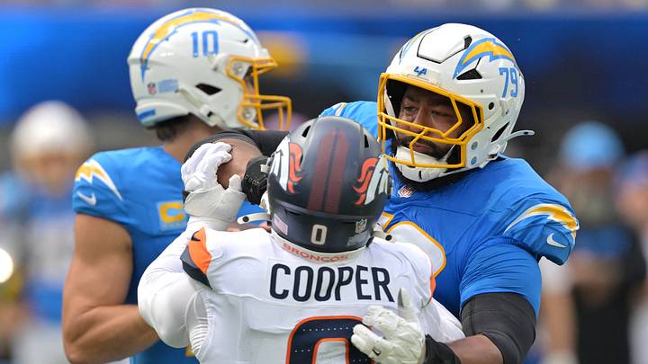 Sep 21, 2025; Inglewood, California, USA; Los Angeles Chargers offensive tackle Trey Pipkins (79) protects quarterback Justin Herbert (10) from Denver Broncos outside linebacker Jonathon Cooper (0) in the first half at SoFi Stadium. Mandatory Credit: Jayne Kamin-Oncea-Imagn Images Sep 21, 2025; Inglewood, California, USA; Los Angeles Chargers offensive tackle Trey Pipkins (79) protects quarterback Justin Herbert (10) from Denver Broncos outside linebacker Jonathon Cooper (0) in the first half at SoFi Stadium. Mandatory Credit: Jayne Kamin-Oncea-Imagn Images