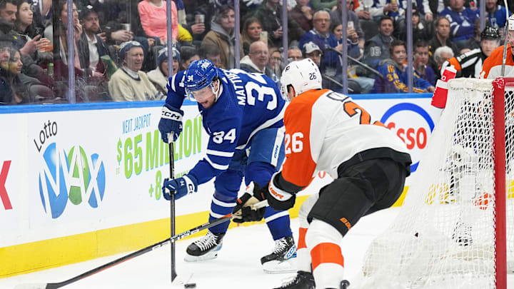 Feb 15, 2024; Toronto, Ontario, CAN; Toronto Maple Leafs center Auston Matthews (34) battles for the