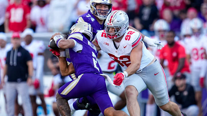 Ohio State Buckeyes defensive end Caden Curry (92) sacks Washington Huskies quarterback Demond Williams Jr. (2) during the second half of the NCAA football game at Husky Stadium in Seattle on Sept. 27, 2025. Ohio State won 24-6. Ohio State Buckeyes defensive end Caden Curry (92) sacks Washington Huskies quarterback Demond Williams Jr. (2) during the second half of the NCAA football game at Husky Stadium in Seattle on Sept. 27, 2025. Ohio State won 24-6.