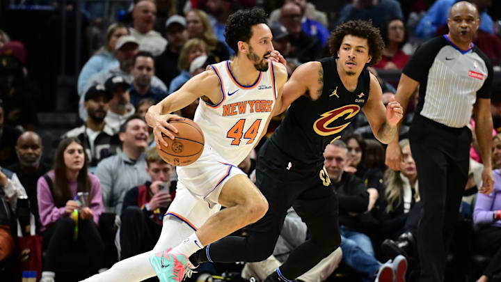 Feb 21, 2025; Cleveland, Ohio, USA;  New York Knicks guard Landry Shamet (44) drives to the basket against Cleveland Cavaliers guard Craig Porter Jr. (9) during the second half at Rocket Arena. Mandatory Credit: Ken Blaze-Imagn Images