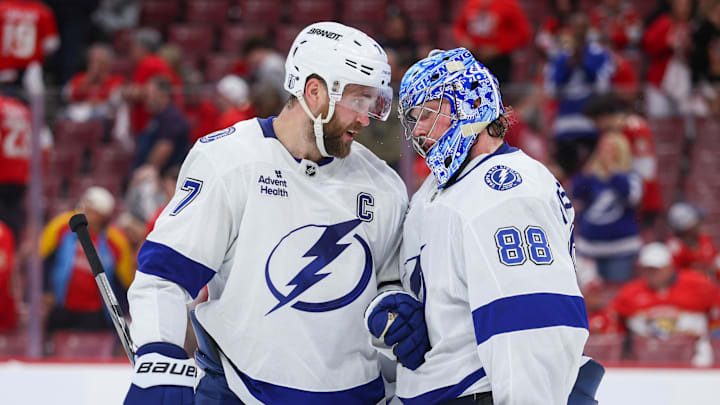 Apr 26, 2025; Sunrise, Florida, USA; Tampa Bay Lightning defenseman Victor Hedman (77) and goaltender Andrei Vasilevskiy (88) celebrate after beating the Florida Panthers in  game three of the first round of the 2025 Stanley Cup Playoffs at Amerant Bank Arena. Mandatory Credit: Nathan Ray Seebeck-Imagn Images