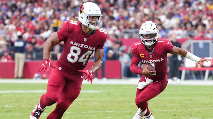 Sep 15, 2024; Glendale, Arizona, USA; Arizona Cardinals quarterback Kyler Murray (1) follows the block of Arizona Cardinals tight end Elijah Higgins (84) during the second half against the Los Angeles Rams at State Farm Stadium. Mandatory Credit: Joe Camporeale-Imagn Images