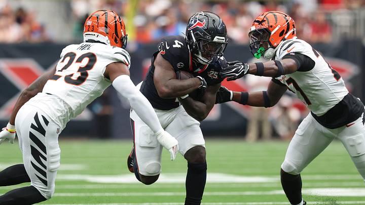 Sep 20, 2026; Houston, Texas, USA; Houston Texans running back Woody Marks (4) runs with the ball as Cincinnati Bengals defensive back Daxton Hill (23) and safety Jordan Battle (27) attempt to make a tackle during the game at Reliant Stadium. Mandatory Credit: Troy Taormina-Imagn Images Sep 20, 2026; Houston, Texas, USA; Houston Texans running back Woody Marks (4) runs with the ball as Cincinnati Bengals defensive back Daxton Hill (23) and safety Jordan Battle (27) attempt to make a tackle during the game at Reliant Stadium. Mandatory Credit: Troy Taormina-Imagn Images