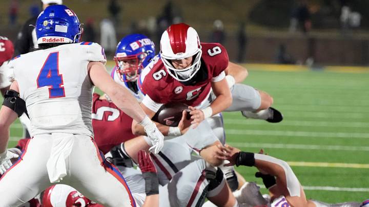 Owasso quarterback Drew Frankenfield (with ball) dives forward in the 2025 Class 6A-I championship game against Bixby. Owasso quarterback Drew Frankenfield (with ball) dives forward in the 2025 Class 6A-I championship game against Bixby.