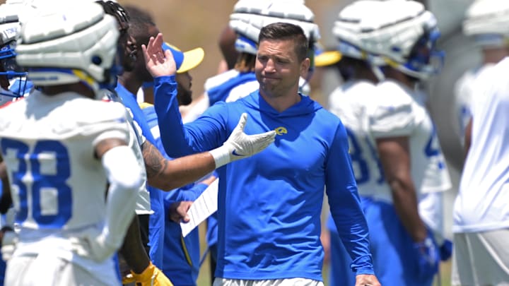 May 28, 2024; Thousand Oaks, CA, USA; Los Angeles Rams defensive coordinator Chris Shula talks with players during OTAs at the team training facility at California Lutheran University. Mandatory Credit: Jayne Kamin-Oncea-Imagn Images