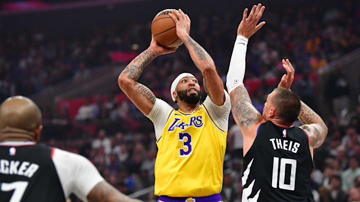 Feb 28, 2024; Los Angeles, California, USA;  Los Angeles Lakers center Anthony Davis (3) shoots against Los Angeles Clippers center Daniel Theis (10) during the first half at Crypto.com Arena. Mandatory Credit: Gary A. Vasquez-Imagn Images